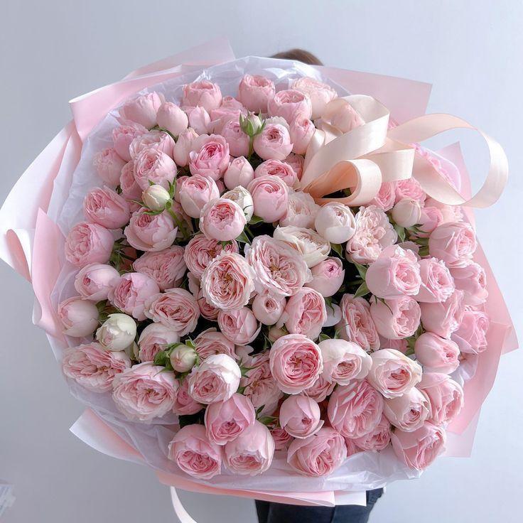 Corporate meeting room with precisely timed floral arrangements that stay elegant through the workday